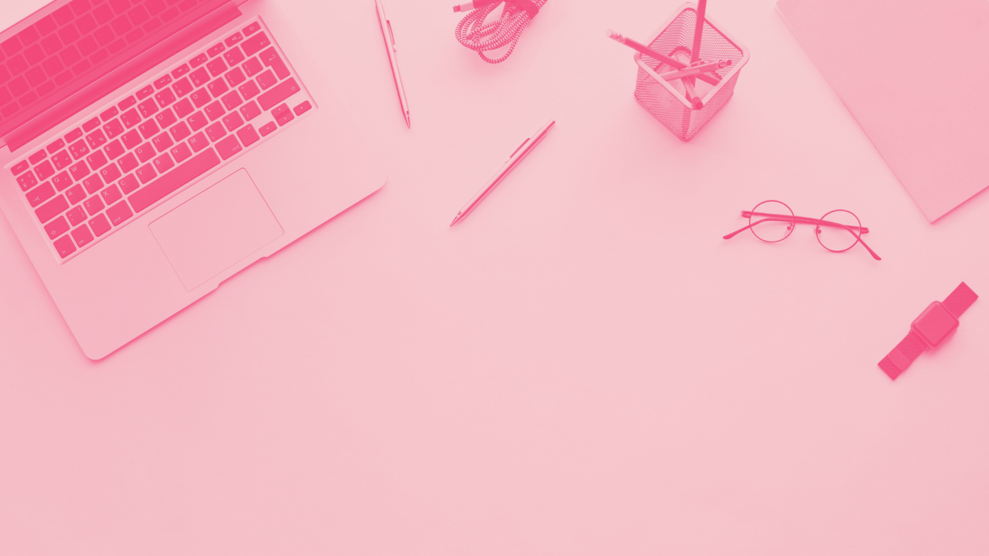 laptop on desk with pencils and glasses
