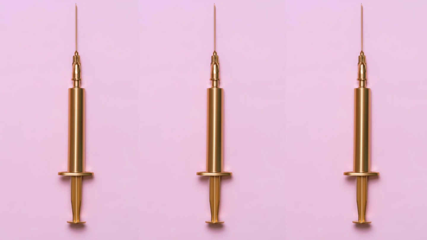 gold syringes on standing up