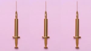gold syringes on standing up