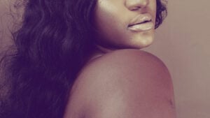 woman cropped to shoulder and lips