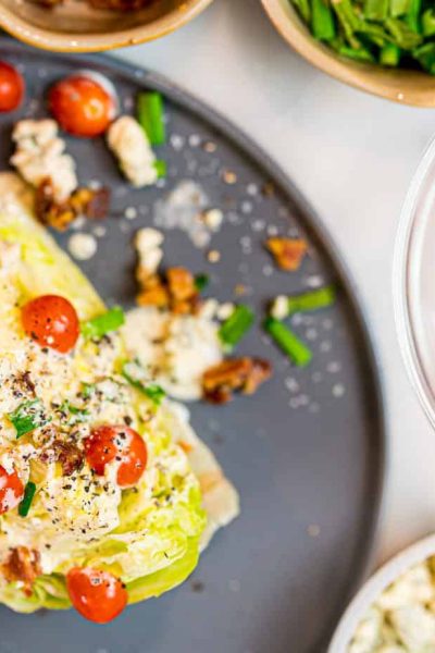 Wedge Salad shot from above with tomatoes, blue cheese and chives