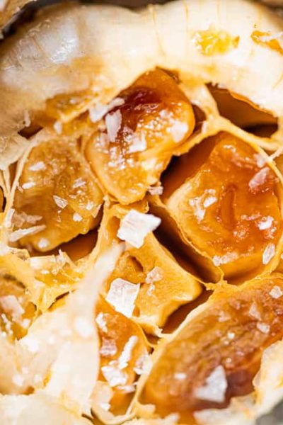 close up photo of roasted garlic with salt
